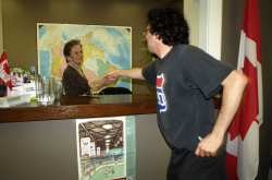 Rob, a 'Free Marc' campaigner, shakes hands with Conservative MP Dona Cadman's assistant Wendy.